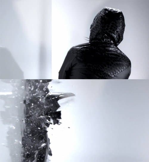 In this apparently random scene, an unknown hooded person smashes into a wall and breaks in multiple pieces. Does this represent a MK slave fragmenting in multiple personalites?