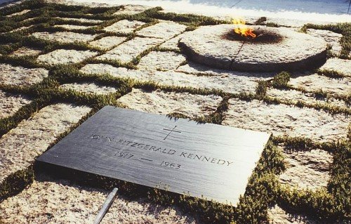 The tombstone of JFK is laid next to the Eternal Flame - symbol of the occult elite and its torch of Illumination.