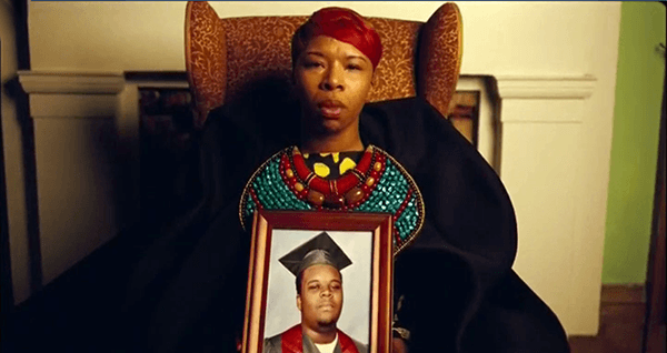 During the song Forwards, pictures of Black men deceased at the hands of police are held by their mothers. 