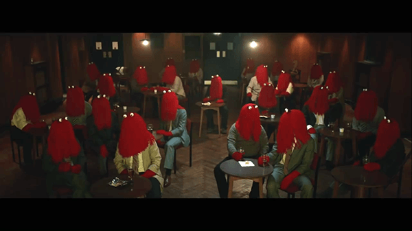 After work, Red Guy goes out. Everybody looks the same. This is the result of mass media programming which produces clones who basically think and act the same.