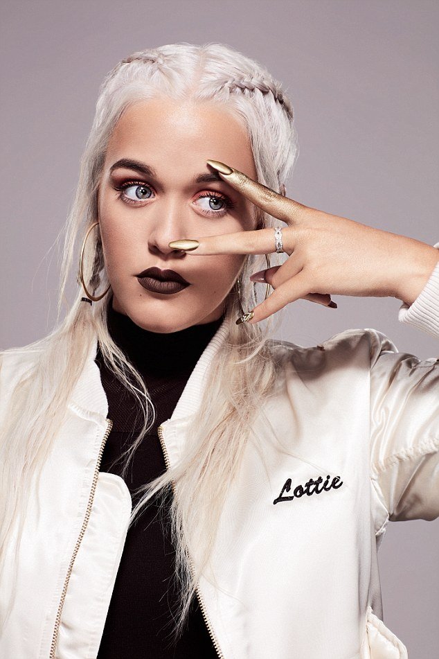 According to crappy celeb sites, Lottie Tomlinson (the sister of One Direction's Louis) is the "next big thing?". Judging by this One-Eye sign, she is already owned by those who decide who is the "next big thing".