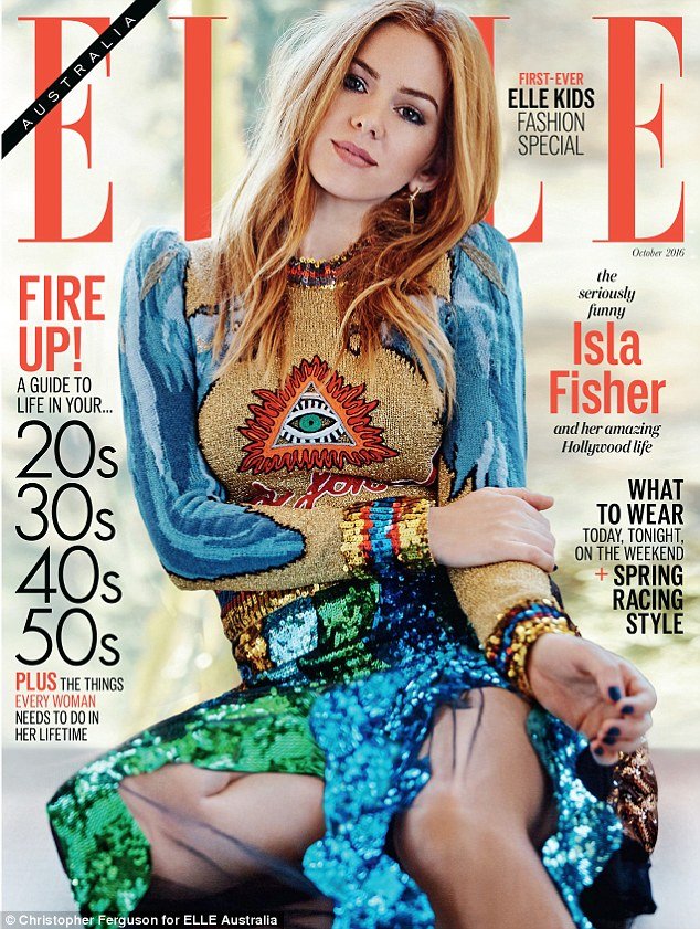 Actress Isla Fisher is on the cover of Elle Australia with a rather visible Illuminati symbol right on her chest. That is kind of like farmers branding cattle with a hot iron.