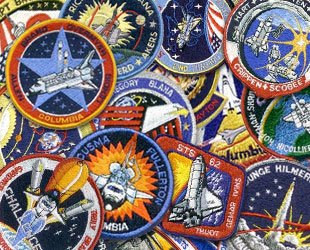 astronaut patches01a Top 10 Most Sinister PSYOPS Mission Patches