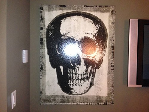 Skull frame on the wall. Rather appropriate since 322 is the Skull and Bones' sacred number.