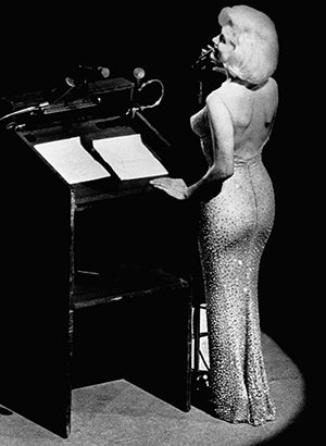 Marilyn singing "Happy Birthday Mr. President" to JFK on May 19th 1962. In this iconic moment in U.S. History, Monroe sings to the President in a sultry voice while wearing a skin-tight dress with nothing under it. When one knows the "hidden side of History" this event was actually a Beta Programming slave singing to the President she is servicing for the whole world to see.