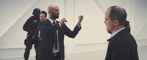 This FBI agent (played by Common) starts playing an air violin after he hears the word "bullshit", letting us know that even people in law enforcement can be mind controlled in order for the elite to get its plans done.