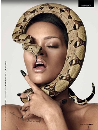 In this pic, a snake almost strangles Rihanna while its head hides on of her eyes. Does this represent the "stranglehold" the industry has on her and other Illuminati puppets?