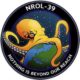 nrol 39 mission patch Logo of New NRO Spy Satellite: An Octopus Engulfing the World with the Words "Nothing is Beyond Our Reach" Underneath