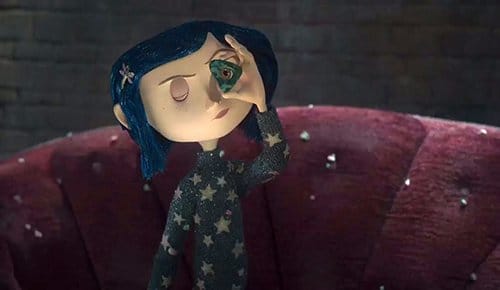 To find the ghost's missing eyes, Coraline must use a symbolic tool: A triangle with a hole in it. Is this a nod to the All-Seeing in triangle?