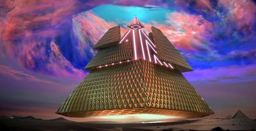 Katy-Patra receives a gigantic floating pyramid which hides, under a golden layer, an illuminated structure reminiscent of the Illuminati's high-tech control of the world.