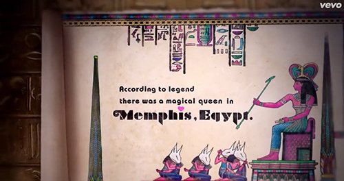 The trailer mentions a "magical Queen" in Egypt. We see the Queen here sitting in front of her subjects, which are mind controlled sex kittens.
