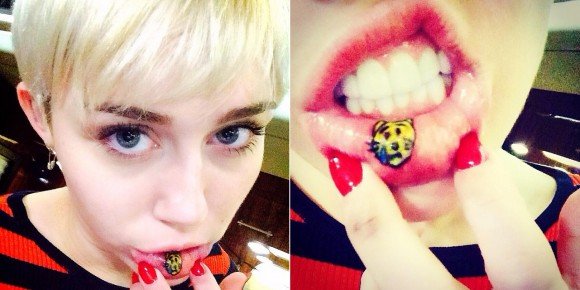 Miley posted on Instagram her new tattoo: A crying kitty inside her lip. How fitting.