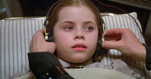 These are not headphones, but pods to electroshock poor Dorothy. We are far from the "gumdrops and lollipops" of the original Wizard of Oz movie.