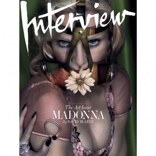 Speaking of Madonna, here she is on the cover of Interview with what looks like a Masonic compass on her face. To make things even more symbolic, she is completely silenced by the mask - like a true puppet.