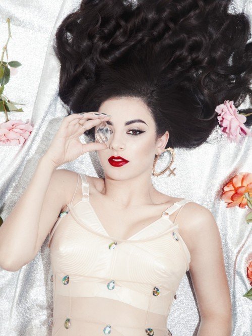 Another up-and-coming British artist that is all about the Agenda is Charli XCX. Here she is doing the one-eye sign with a diamond-like stone - the stone used to represent "Presidential Models" in Kitten Programming symbolism.