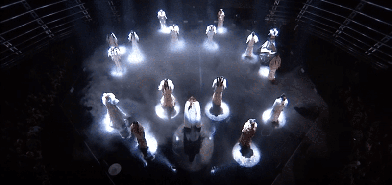 The performance began in a classic ritualistic fashion: With Beyoncé and her girls dressed in virginal white garments.